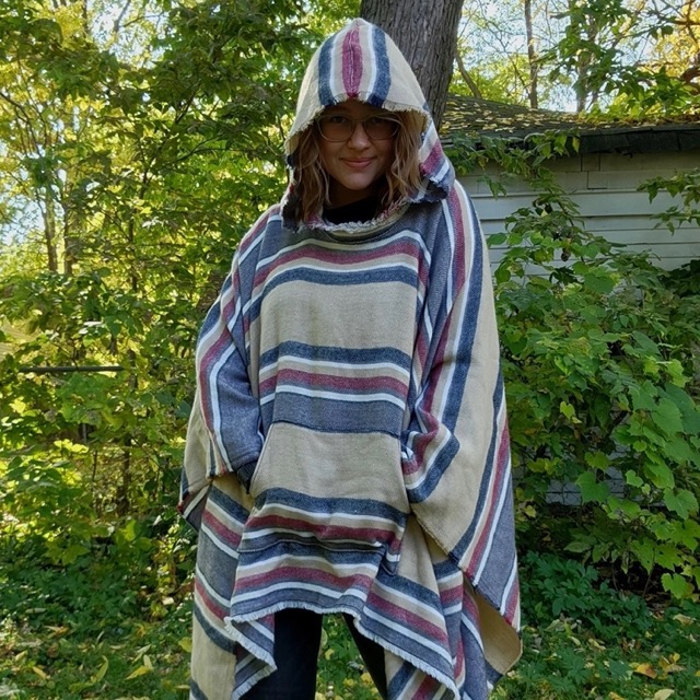 A model wearing a poncho